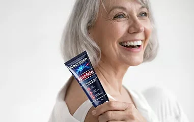 Smiling woman holding a tube of Naurozen cream in both hands